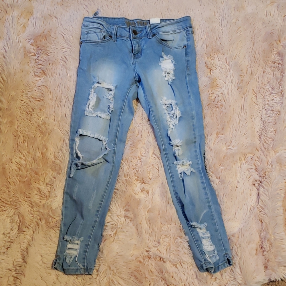 VIP distressed light blue jeans.